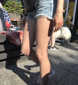 Girl in Denim Shorts with Amazing Hot Legs Fixing Her Sandals Street Candid Photo Gallery