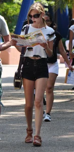 Skinny blonde chick in little denim shorts