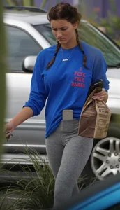 Hot college girl getting food in grey leggings