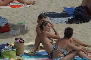 Topless girls on a beach in Barcelona