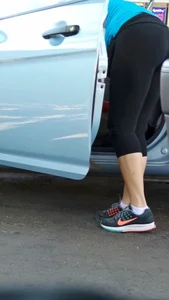 Girl in tight see through leggings with nice ass cleaning her car