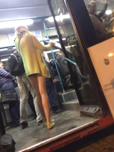 Hot Blonde with Long Skinny Legs Behind the Closing Doors of the Tram