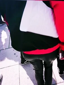 Ass in leather pants closeups on the street