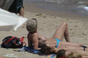 Girls on a nude beach in Sitges, Spain