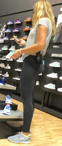 Shoe store employee with a sexy bubble butt in leggings