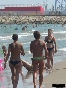 Bunch of sexy babes at the beach in thong bikinis