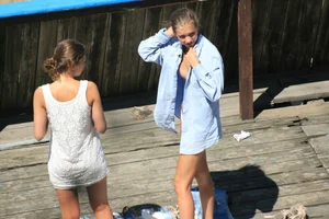 Two teens stripping and going topless to tan