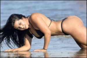 Two sexy ass friends at the beach in thong bikinis