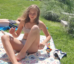 A Young Skinny Candid Girl in a Swimsuit at the Beach