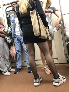 Nice candid legs in black pantyhose in a subway train