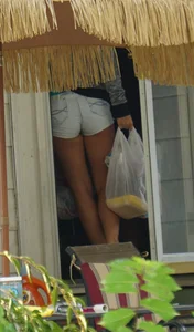 Girl next door teen neighbor bringing in groceries in short jean shorts