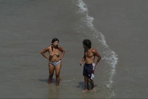 Girls on a nude beach in Sitges, Spain
