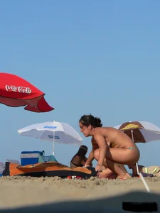 2 topless thonged sexy friends on the beach with great bodies