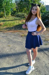 Cute teen in a skirt on the road, she's got cat's ears!