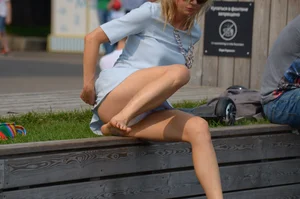 Blonde milf upskirted showing white panties and some pubes