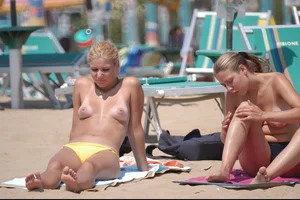 Girls on a nude beach in Bibione, Italy