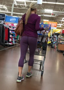 Sexy blonde shopping at Walmart in purple leggings with some vpl