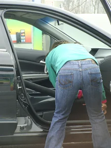 Girls cleaning their cars in jeans and pants