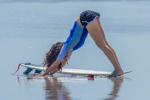 Candid girls surfing on the beach