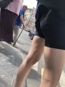 Great legs and booty in spandex shorts of a street candid girl crossing the street