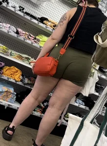 Juicy brunette in green spandex shorts OC