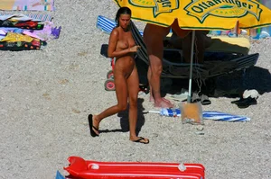 Ula FKK Sexy brunette on a nude beach topless, bottomless and with blue thong