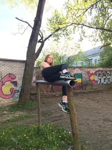 Girl in Yoga Pants with Skinny Ass and Legs Lying on the Metal Tube Thing