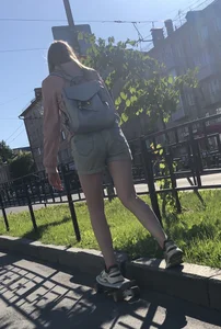 Girl in Denim Shorts on Skateboard Street Candid Photos