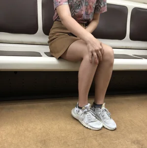Amazing Hot Girl in a Skirt and Sneakers Sitting Cross-Legged in the Subway Train and on the Escalator Candid Photos Gallery