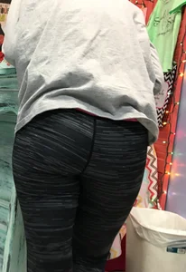 Ass standing around in tight grey patterned leggings