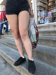 Milf's Legs in Shorts Closeup on the City Street Stairs