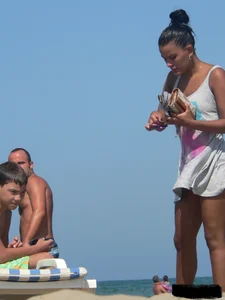 Hot ass topless beach girl with great tits lets her little brother oil up her ass in thong bikini