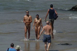 Girls on a nude beach in Sitges, Spain