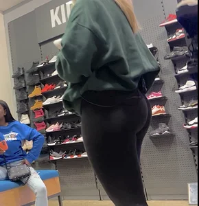 Blonde Finish line store worker in black leggings