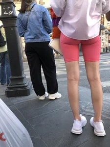 Awesome booty in spandex shorts, candid girl on a sidewalk