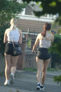 Pair of oblivious teens in short shorts