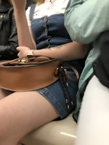 Closeups of a hot candid girl sitting in a subway train