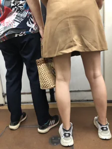 Amazing Hot Girl in a Skirt and Sneakers Sitting Cross-Legged in the Subway Train and on the Escalator Candid Photos Gallery