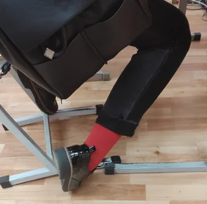 Closeups of a Candid College Teen's Legs in Pants, Shoes And Red Socks - Sitting at Her Desk in Class