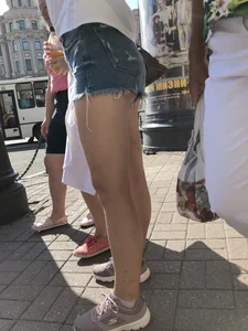 Awesome ass in fringed denim shorts and perfect legs, candid girl's street photos
