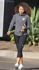 Beautiful black girl in Nike leggings in the parking lot