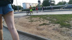 Girl walking in denim shorts showing some of her ass cheeks