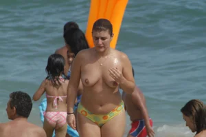 Topless girls on a beach in Barcelona