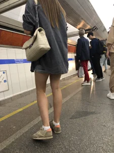 Very hot candid girl sitting in a subway train, closeups of her legs