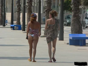 Bunch of sexy babes at the beach in thong bikinis