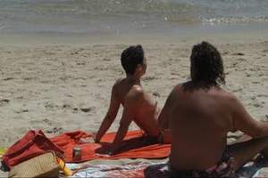 Girls on a nude beach in Sitges, Spain
