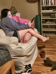 Girl Sitting in Armchair in Mini Shorts With Bare Feet Home Creepshot