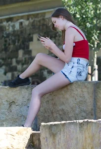 Pretty candid girls with nice legs sitting in denim shorts
