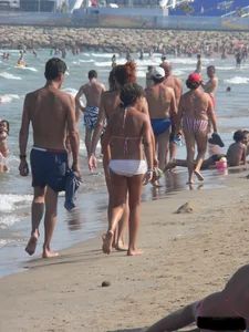 Bunch of sexy babes at the beach in thong bikinis