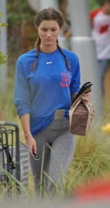 Hot college girl getting food in grey leggings